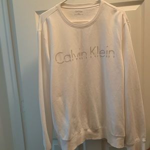Calvin Klein’s white pull over sweater
